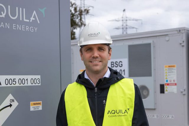 Aquila Clean Energy Crew member standing at the Kairos Battery Storage System