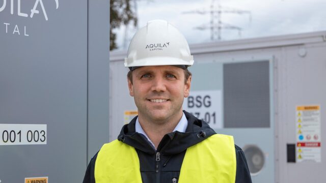 Aquila Clean Energy Crew member standing at the Kairos Battery Storage System