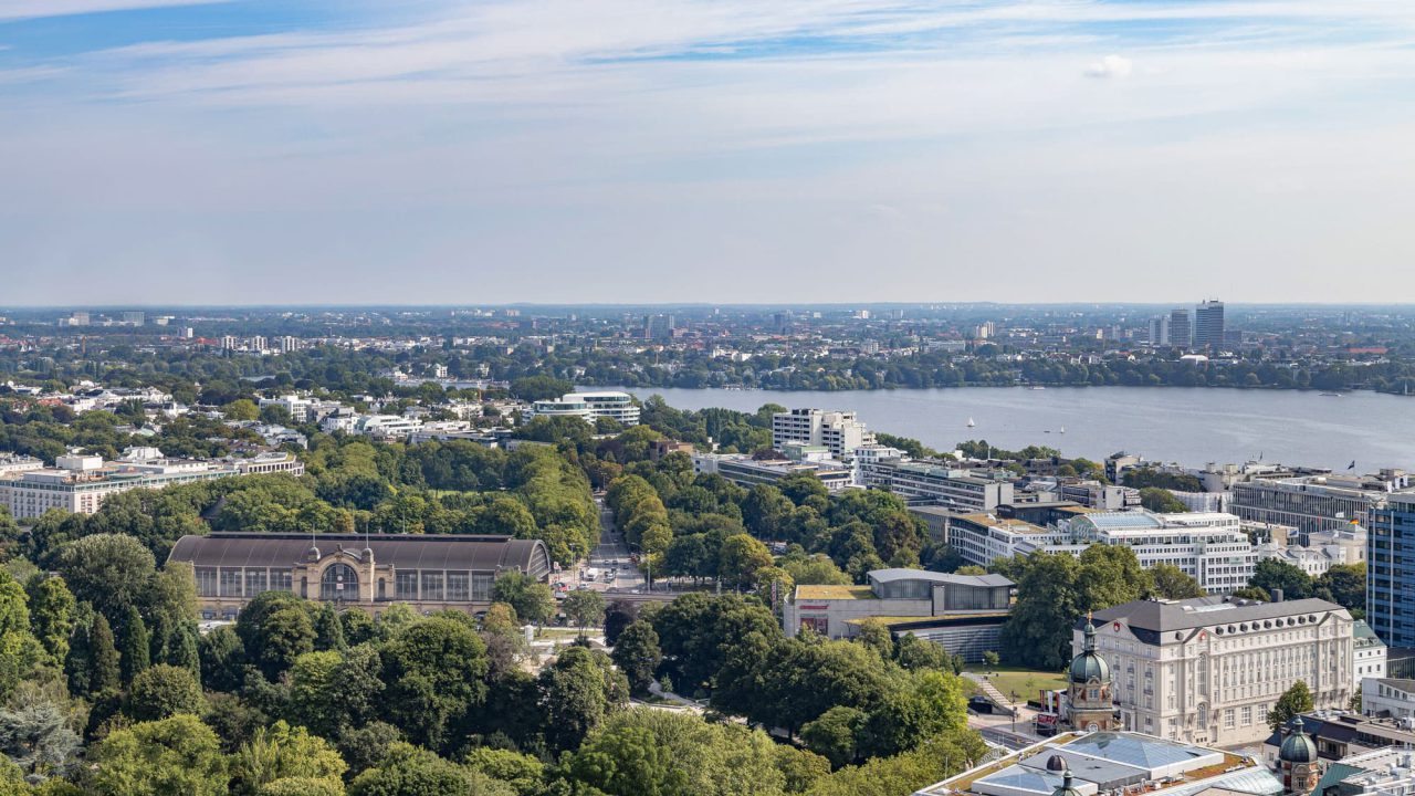 Hamburg cityscape and water from above and cloudy sky.