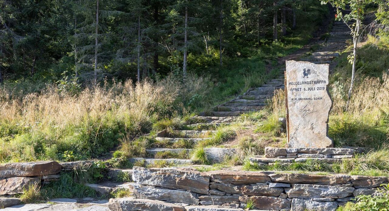 Stone stairs and stone sign in the forest in Øyfjellet mountain.